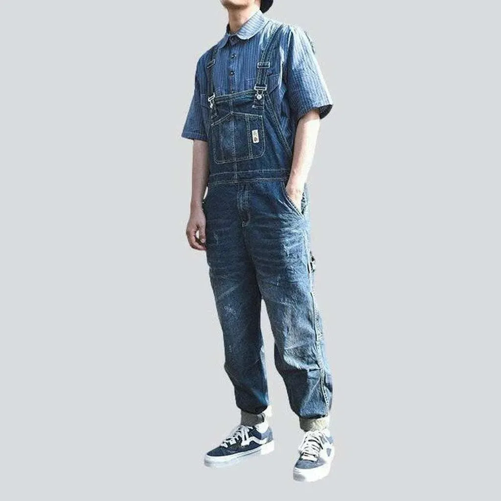 Loose men's medium wash overall