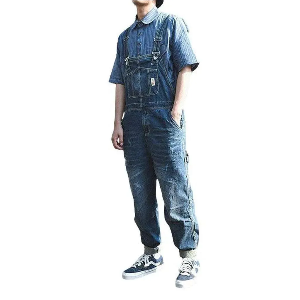 Loose men's medium wash overall